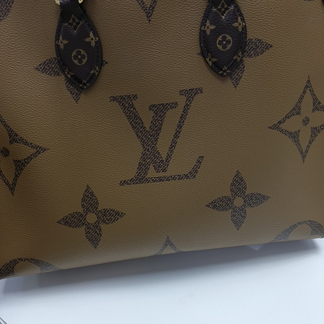 ONTHEGO MM Monogram Coated Canvas Brown