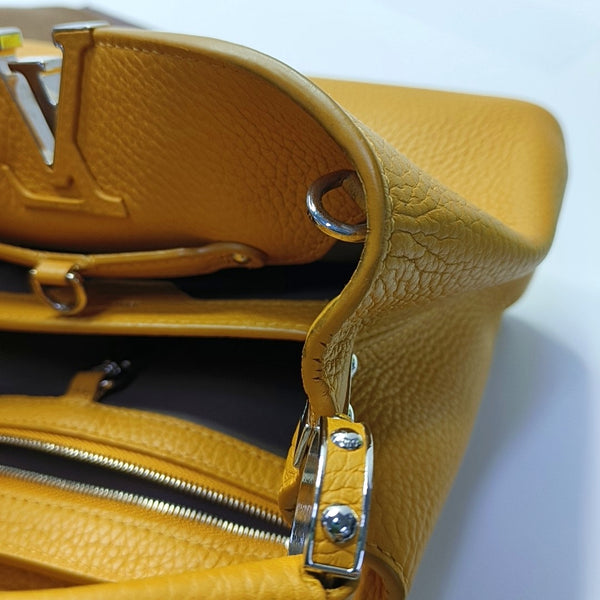Authenticated pre-owned  CAPUCINES BB Calfskin Orange - Shoulder Bag at Looply