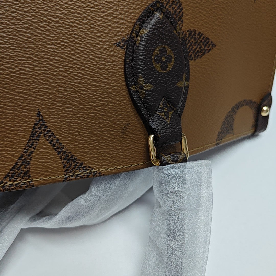 ONTHEGO MM Monogram Coated Canvas Brown