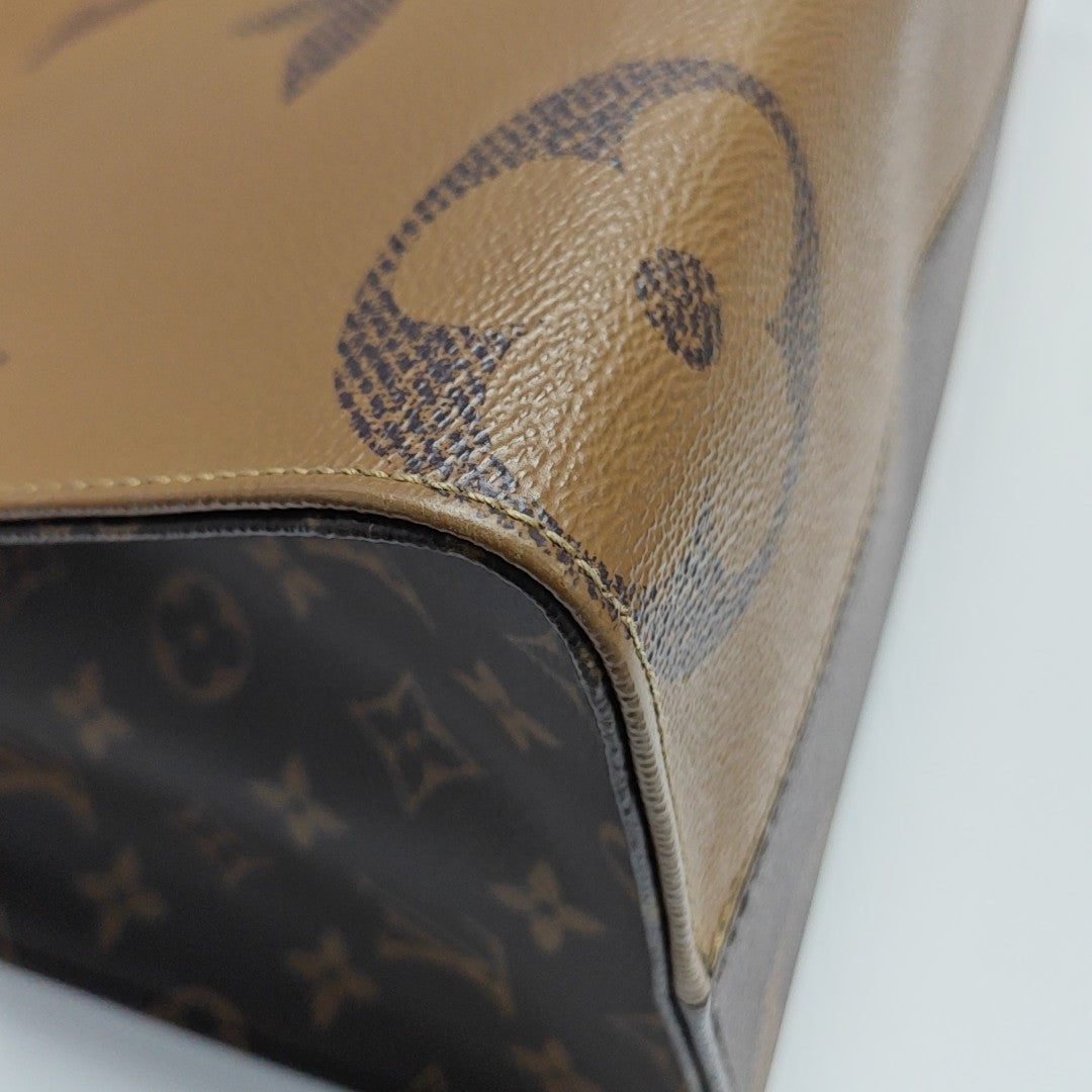 ONTHEGO MM Monogram Coated Canvas Brown