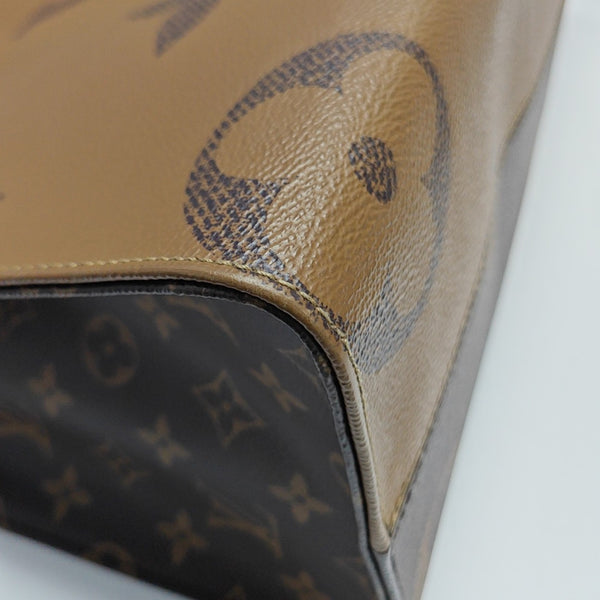 ONTHEGO MM Monogram Coated Canvas Brown