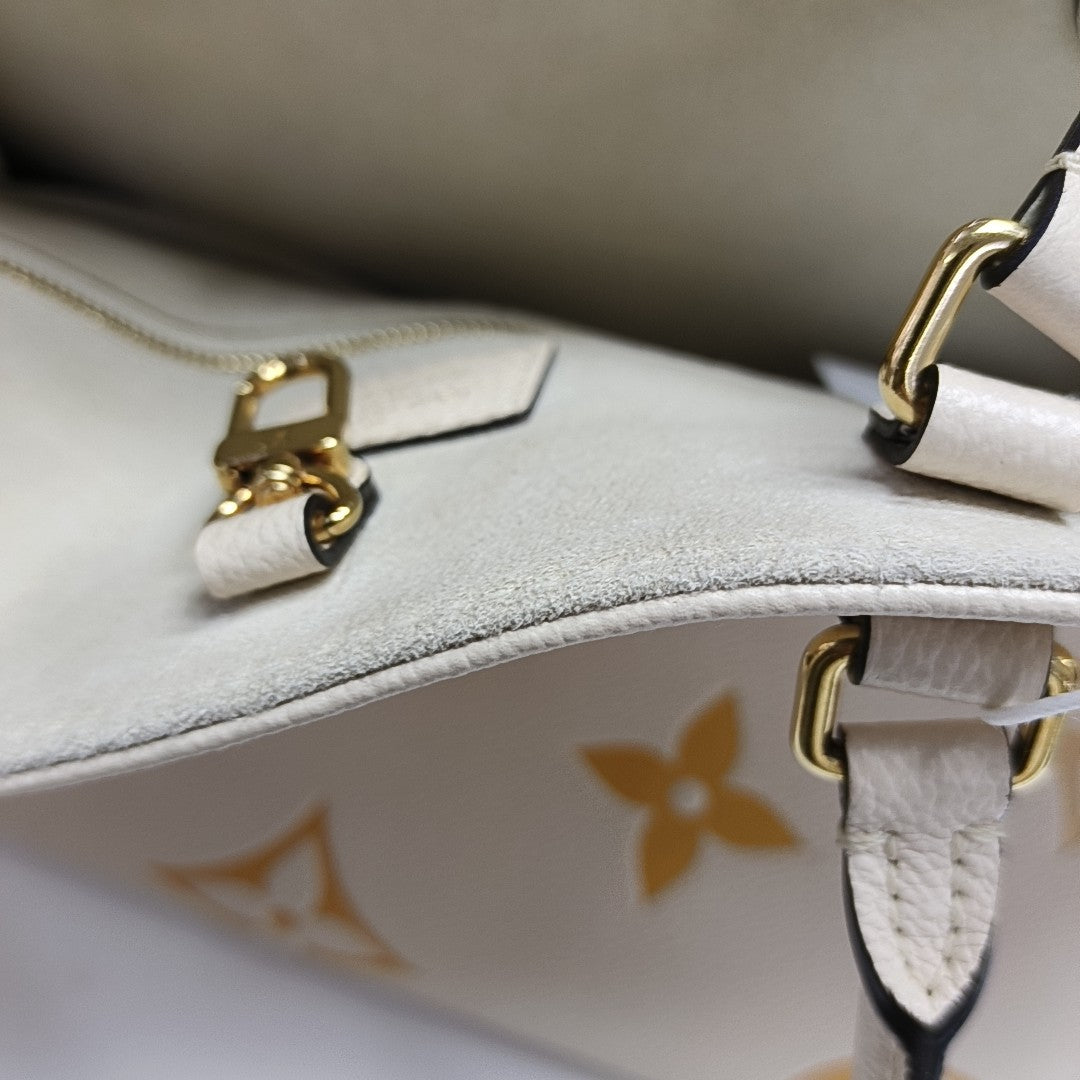 ONTHEGO MM Monogram Calfskin Beige