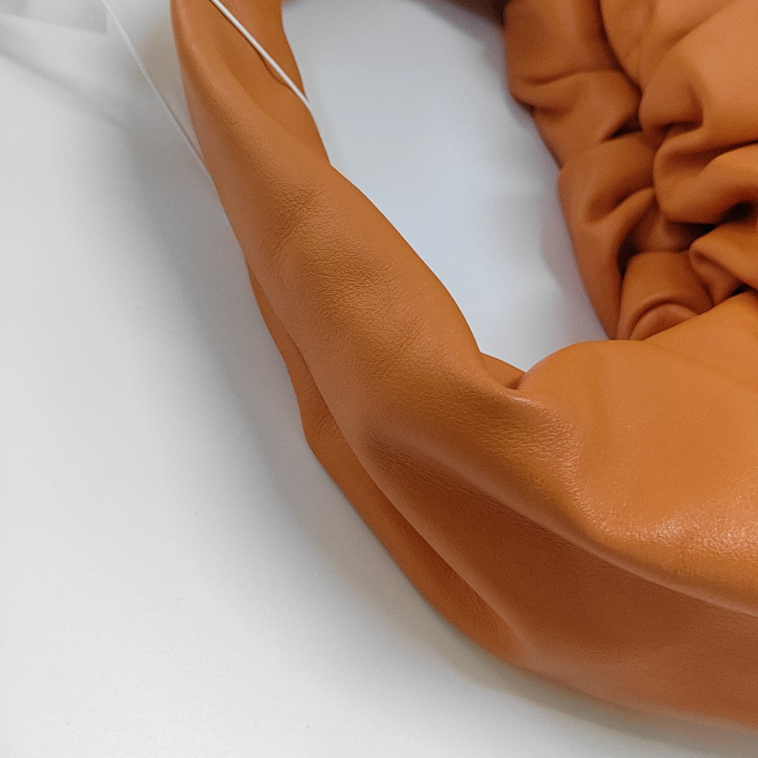 Authenticated pre-owned  The Pouch Calfskin Orange - Top Handle Bag at Looply