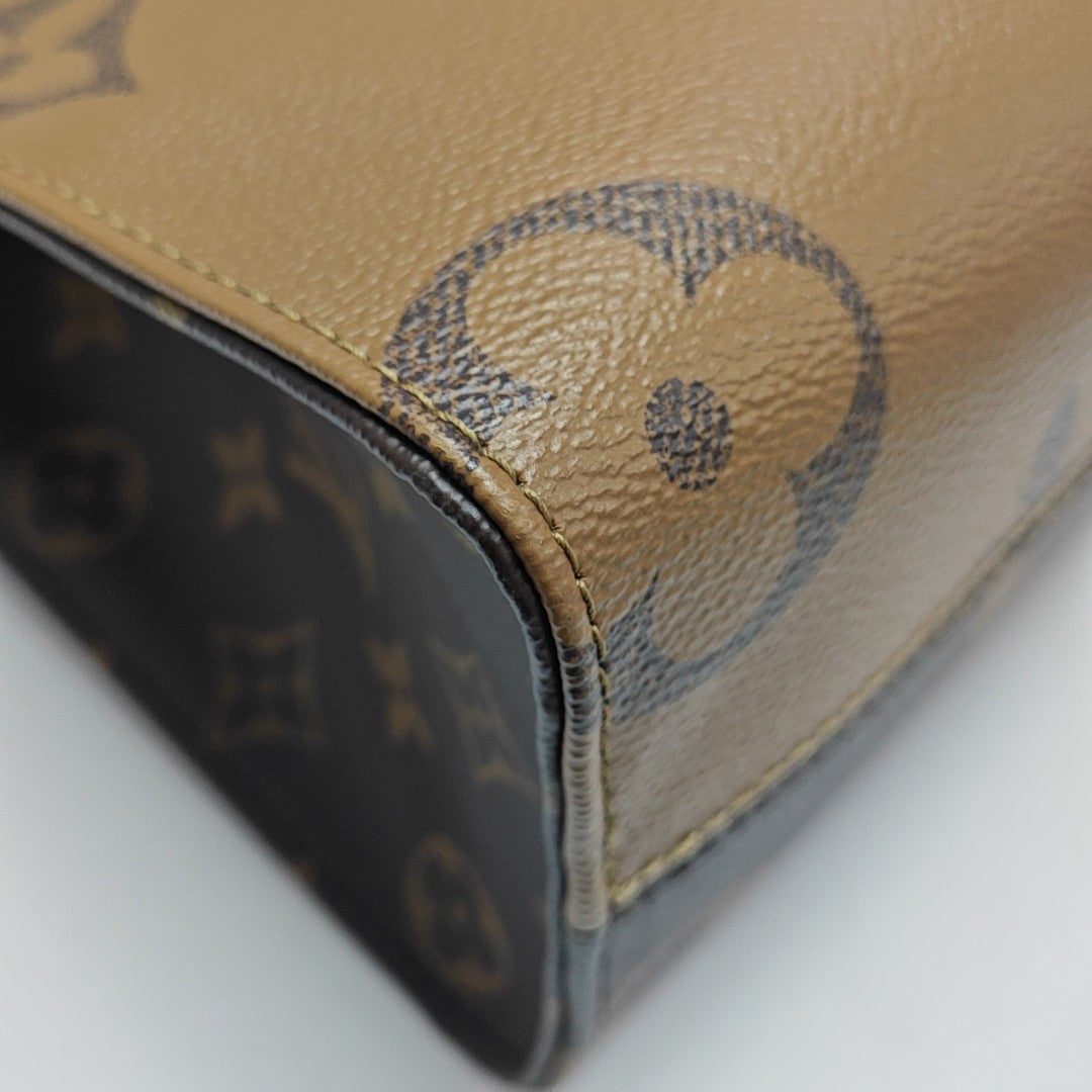 ONTHEGO PM Monogram Coated Canvas Brown
