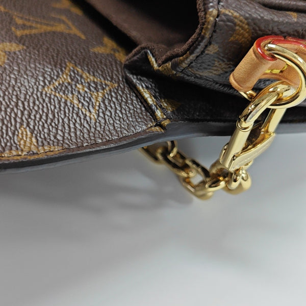 MÉTIS EAST WEST Monogram Coated Canvas Brown