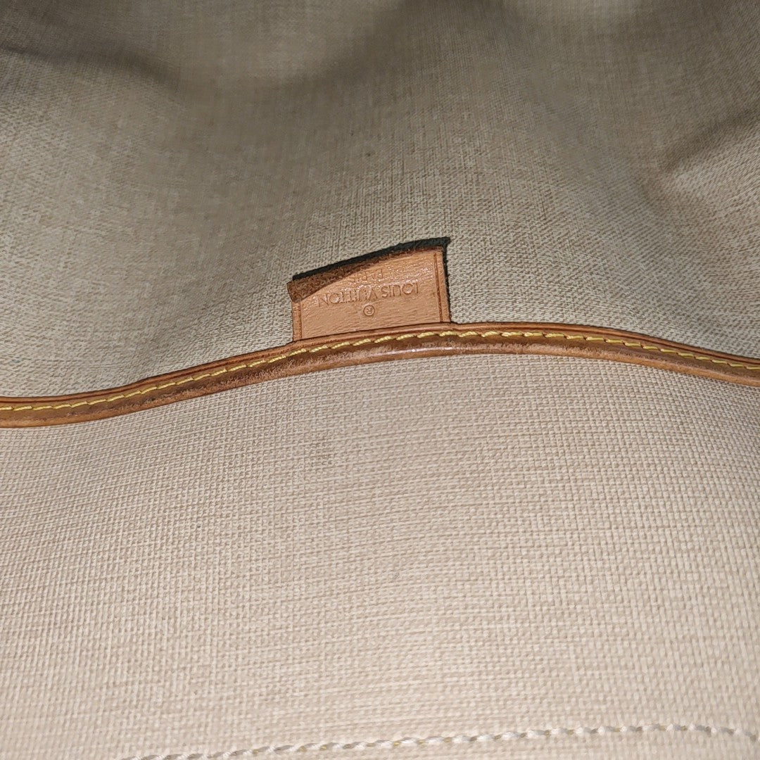 EXCURSION Monogram Coated Canvas Brown