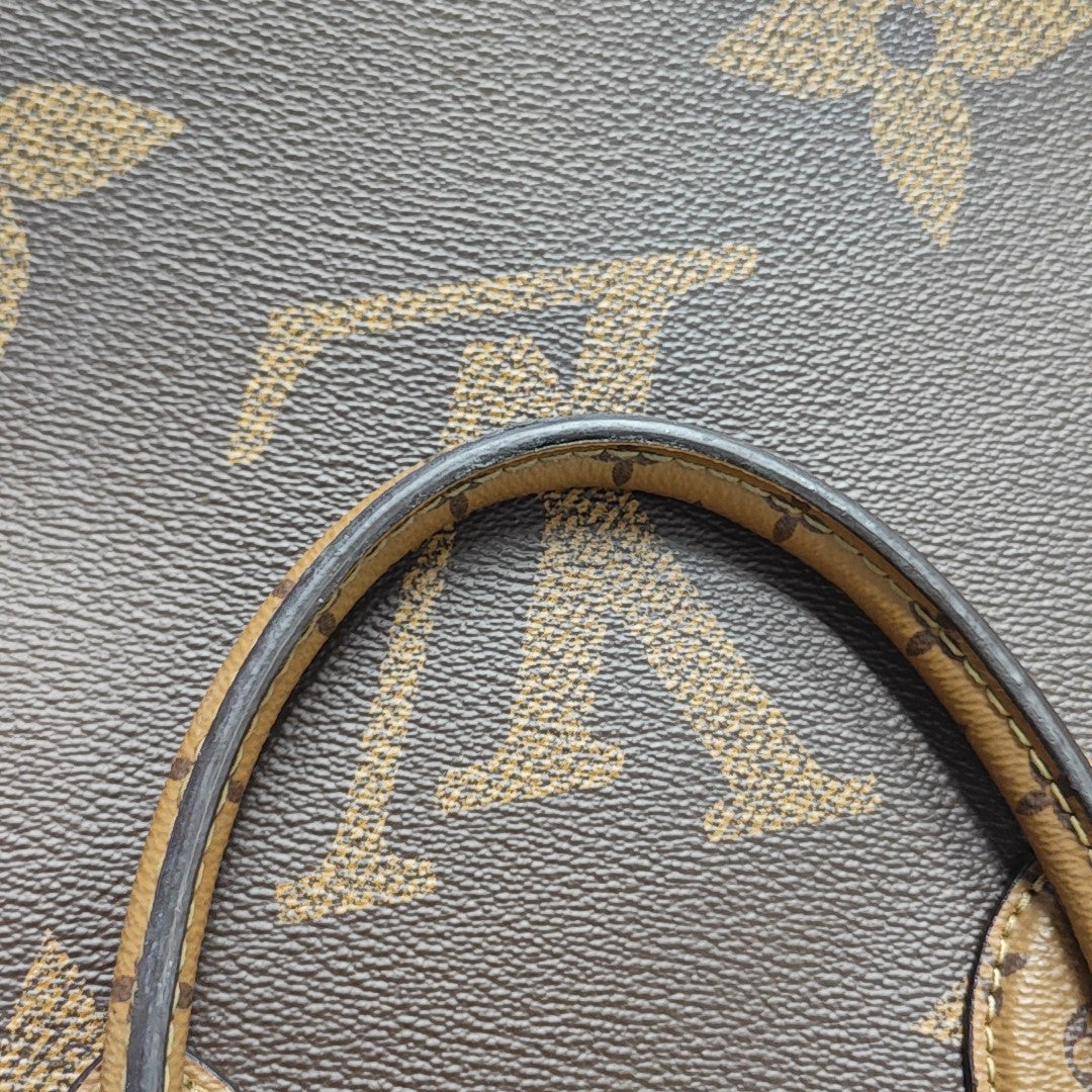 ONTHEGO MM Monogram Coated Canvas Brown