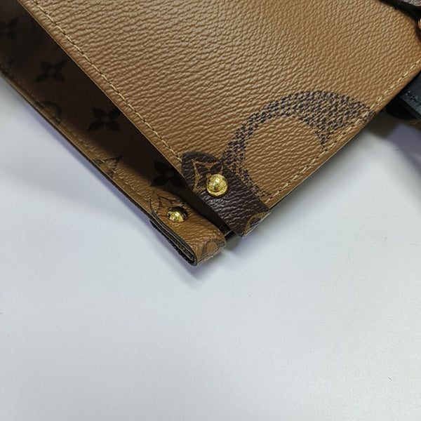 ONTHEGO MM Monogram Coated Canvas Brown