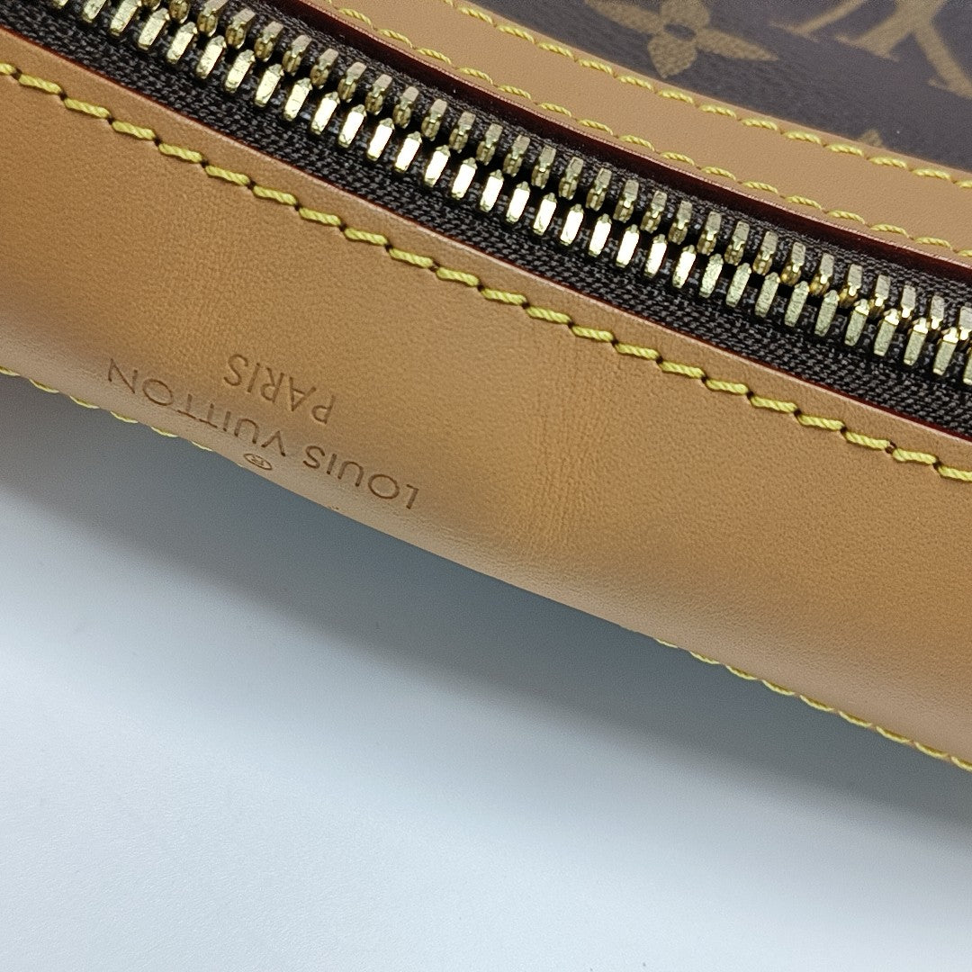 SAUMUR PM Monogram Coated Canvas Brown