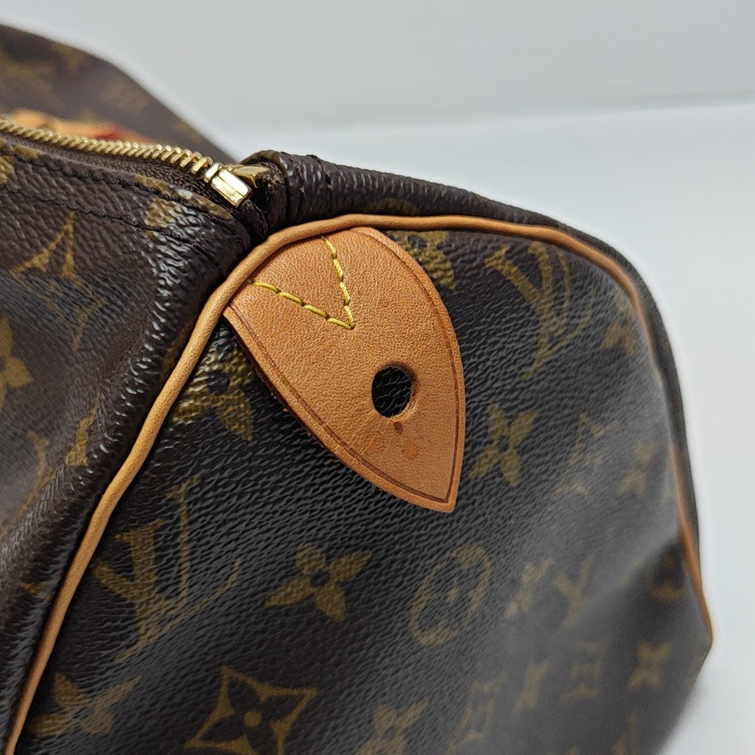 SPEEDY 30 Monogram Coated Canvas Brown