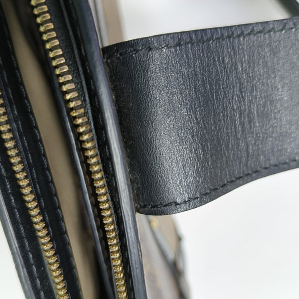 TRUNK Monogram Coated Canvas Brown