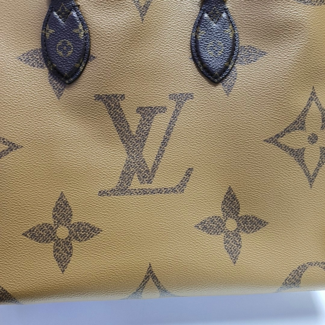 ONTHEGO MM Monogram Coated Canvas Brown