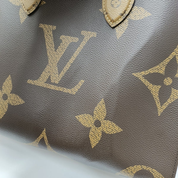 ONTHEGO MM Monogram Coated Canvas Brown