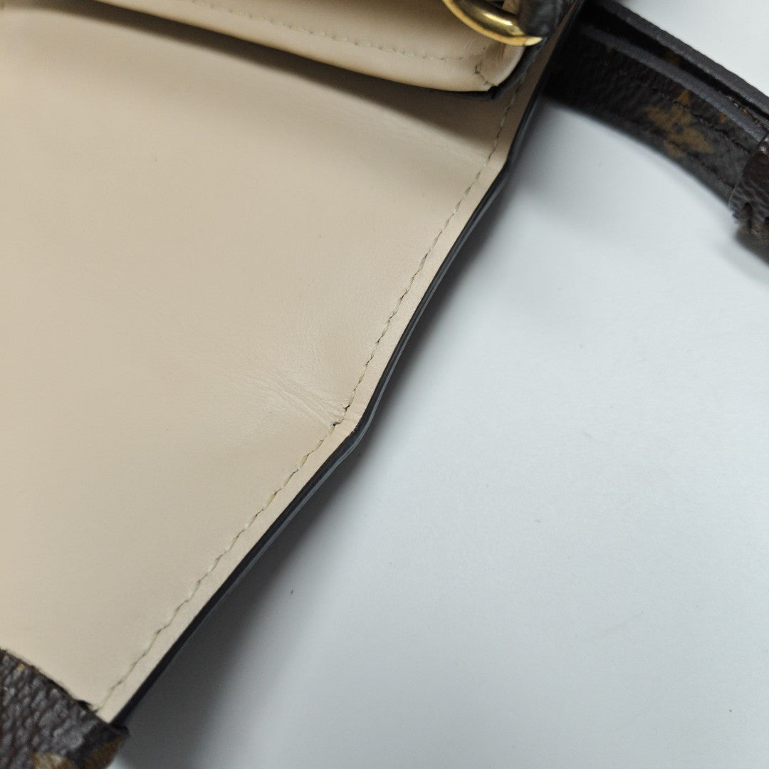 TRUNK Monogram Coated Canvas Brown