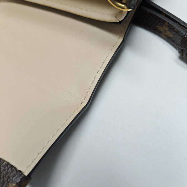 TRUNK Monogram Coated Canvas Brown