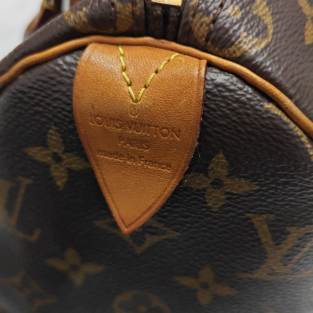 SPEEDY 25 Monogram Coated Canvas Brown