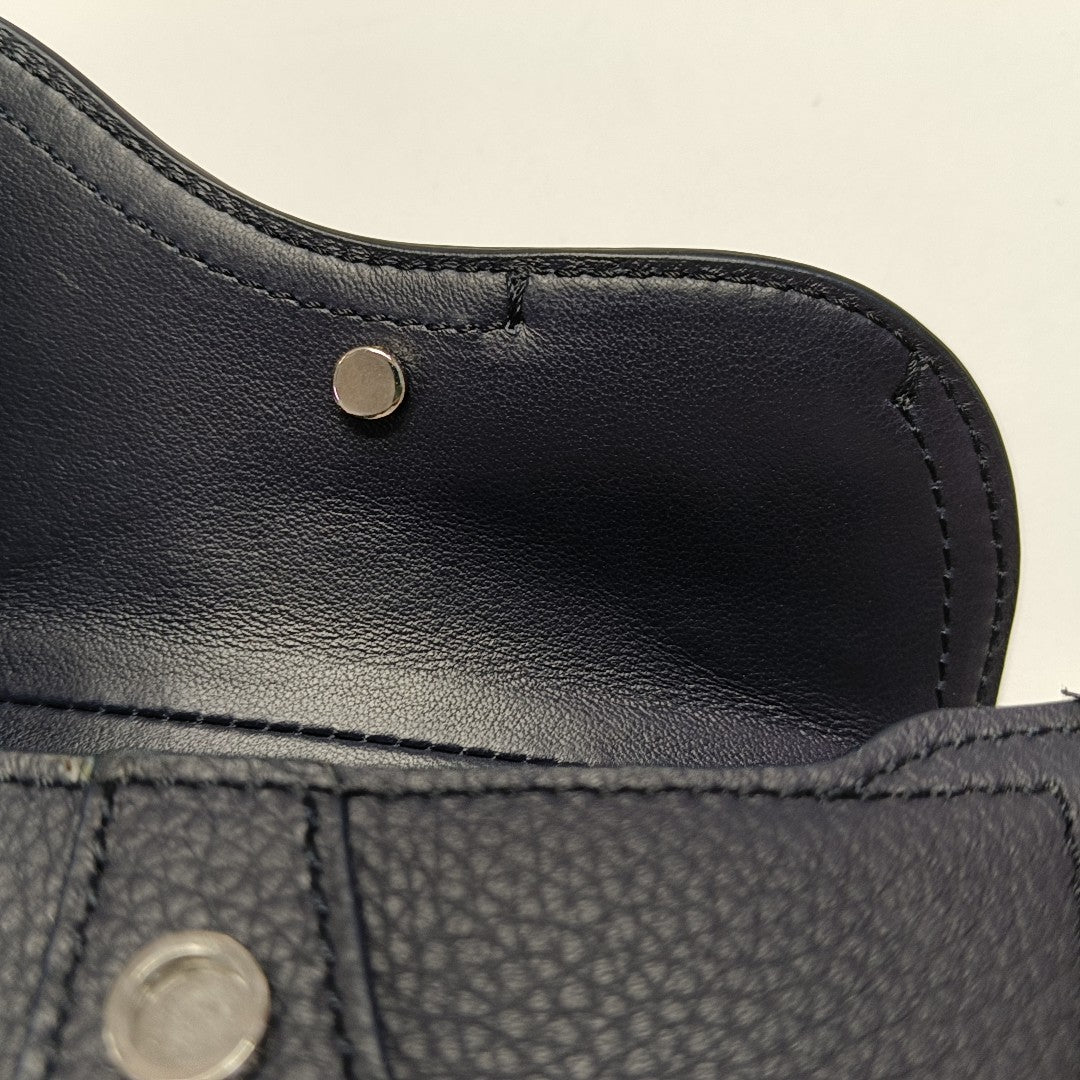 Authenticated pre-owned  Saddle Calfskin Blue - Clutch at Looply