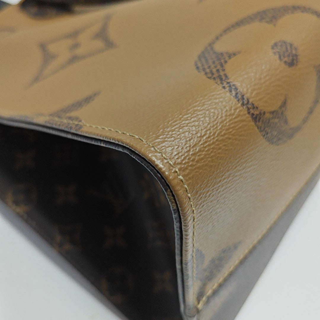 ONTHEGO GM Monogram Coated Canvas Brown