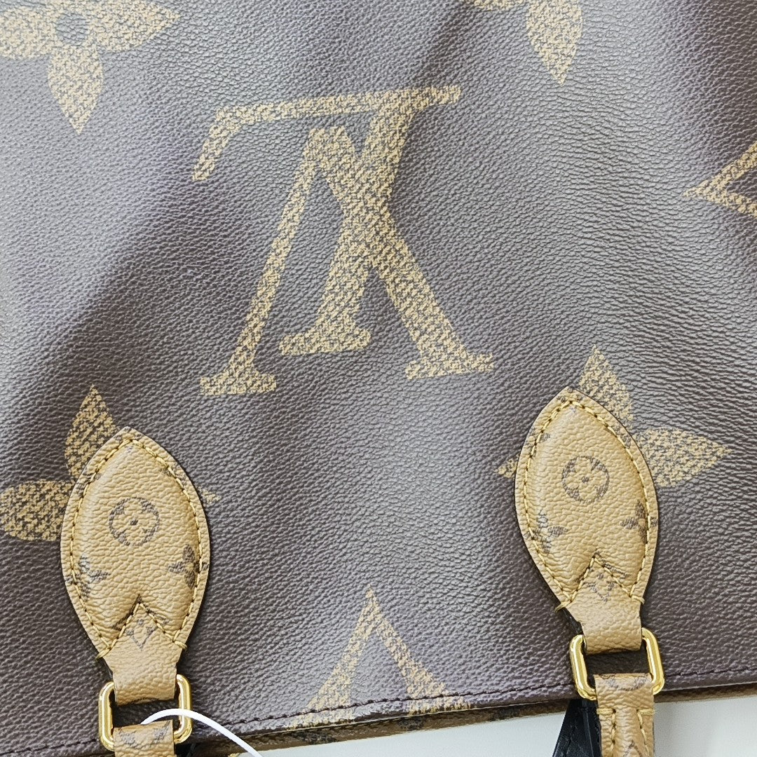 ONTHEGO MM Monogram Coated Canvas Brown