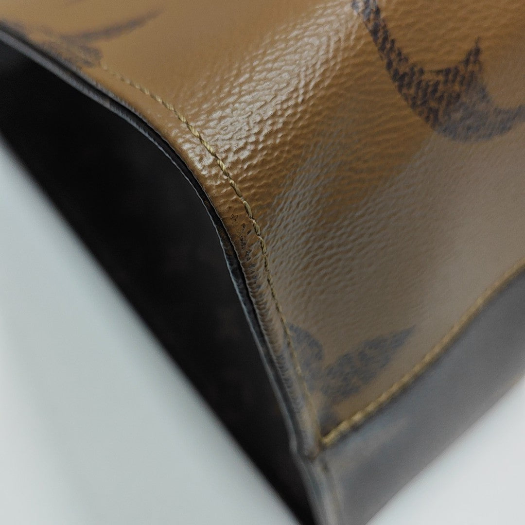 ONTHEGO GM Monogram Coated Canvas Brown