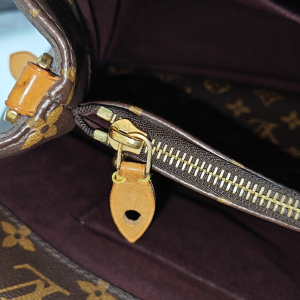MONTAIGNE GM Monogram Coated Canvas Brown