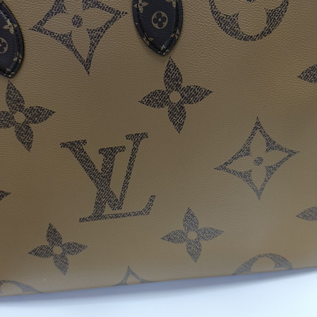 ONTHEGO GM Monogram Coated Canvas Brown