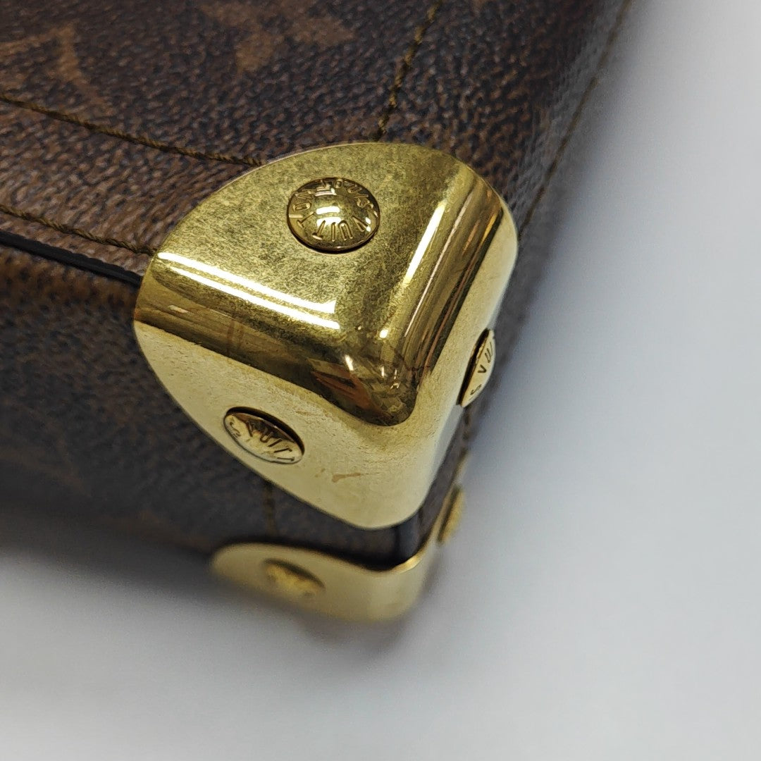 TRUNK Monogram Coated Canvas Brown