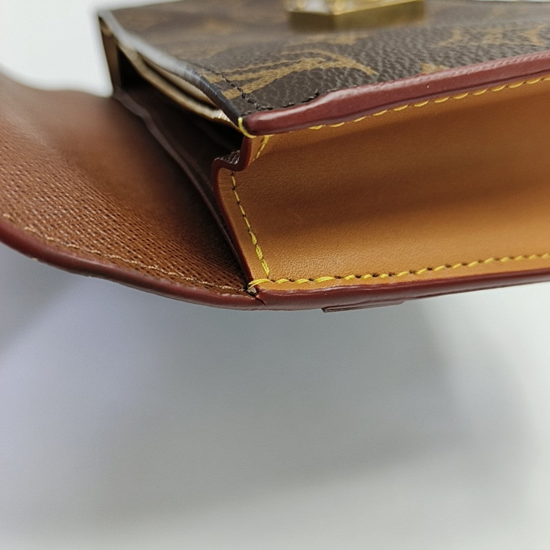 S LOCK Monogram Coated Canvas Brown