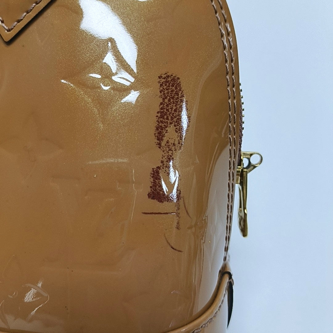 Authenticated pre-owned  ALMA Monogram Patent Leather Yellow - Shoulder Bag at Looply