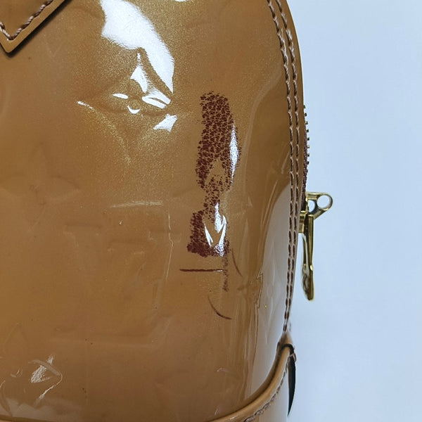 Authenticated pre-owned  ALMA Monogram Patent Leather Yellow - Shoulder Bag at Looply