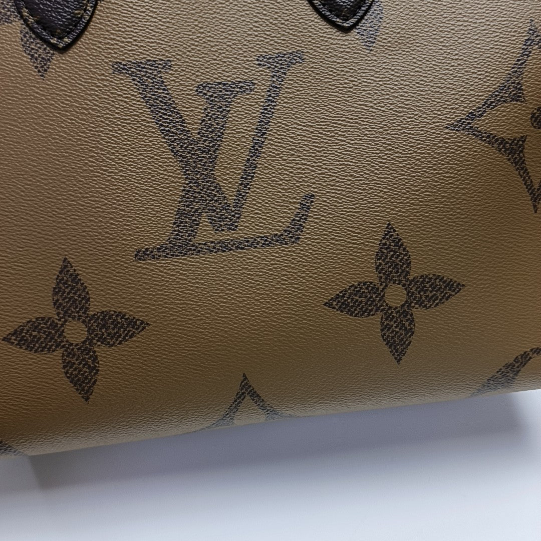 ONTHEGO MM Monogram Coated Canvas Brown