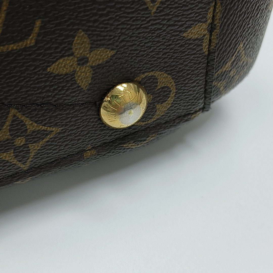MONTAIGNE GM Monogram Coated Canvas Brown