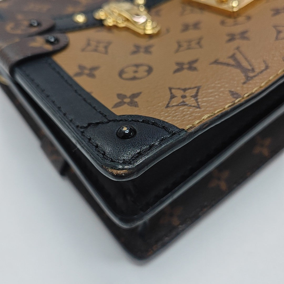TRUNK Monogram Coated Canvas Brown