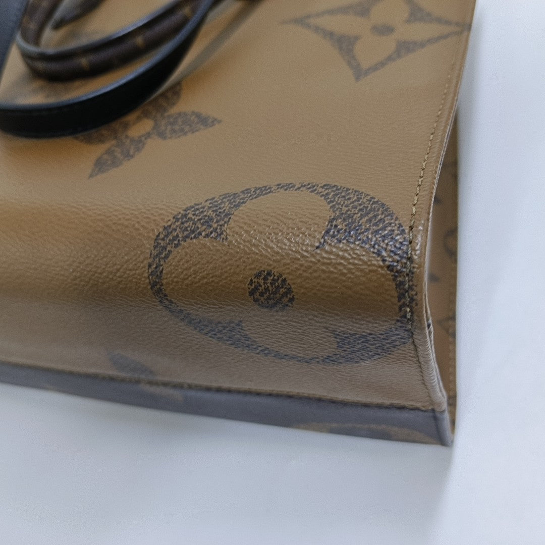 ONTHEGO MM Monogram Coated Canvas Brown