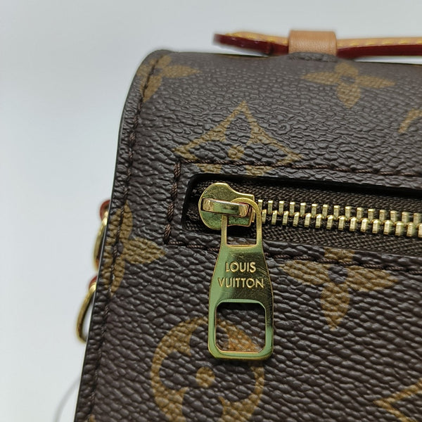 MÉTIS EAST WEST Monogram Coated Canvas Brown