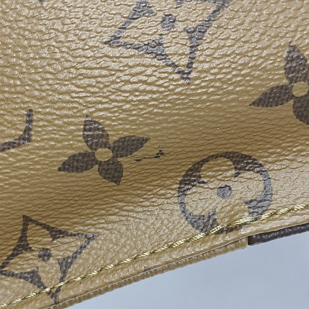 ONTHEGO MM Monogram Coated Canvas Brown