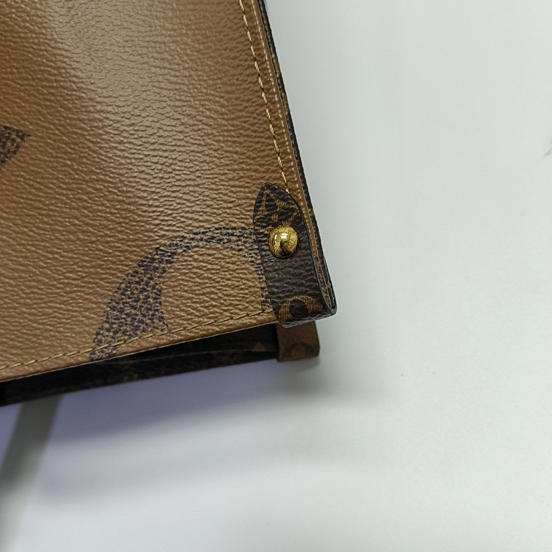 ONTHEGO MM Monogram Coated Canvas Brown