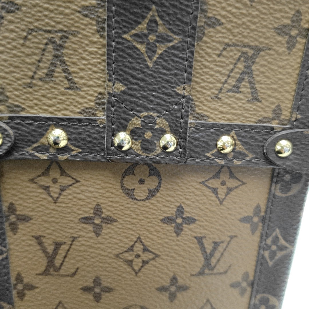 TRUNK Monogram Coated Canvas Brown