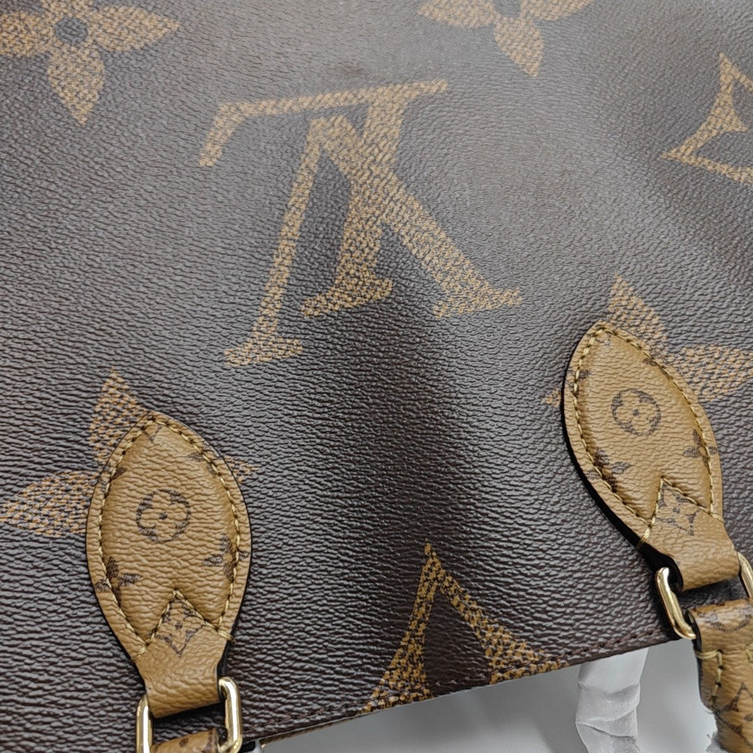 ONTHEGO MM Monogram Coated Canvas Brown