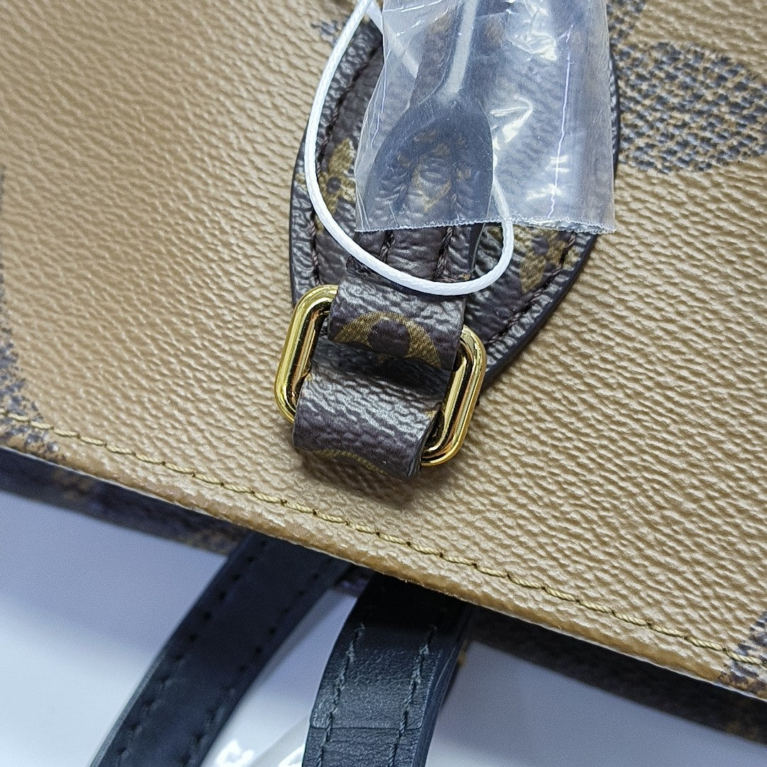 ONTHEGO MM Monogram Coated Canvas Brown