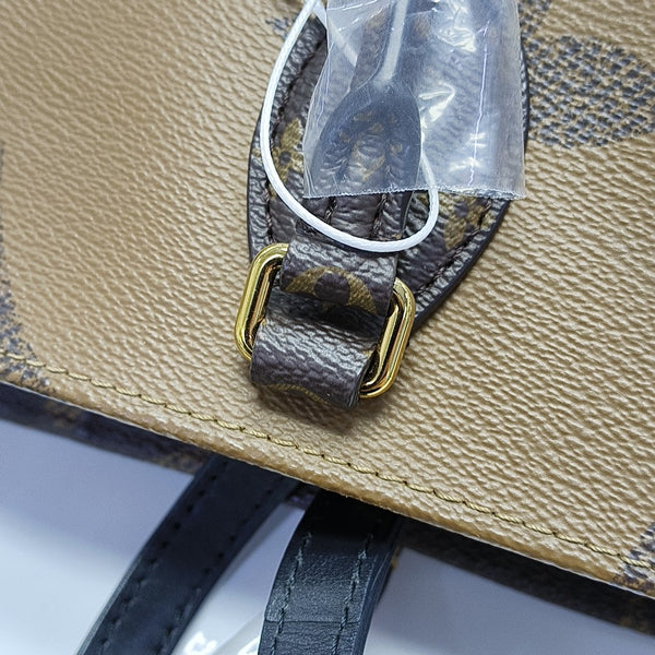 ONTHEGO MM Monogram Coated Canvas Brown