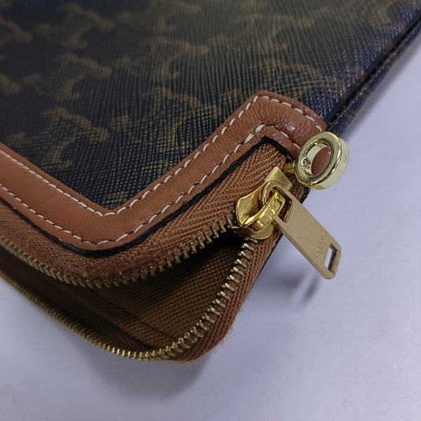 Authenticated pre-owned  TRIOMPHE Small Coated Canvas Brown - Clutch at Looply