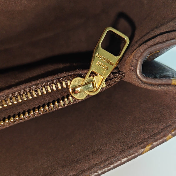 MÉTIS EAST WEST Monogram Coated Canvas Brown