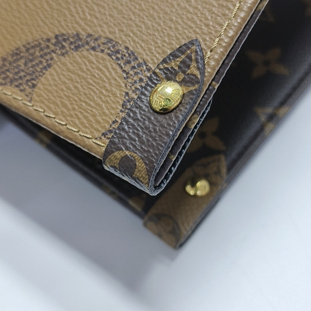 ONTHEGO MM Monogram Coated Canvas Brown