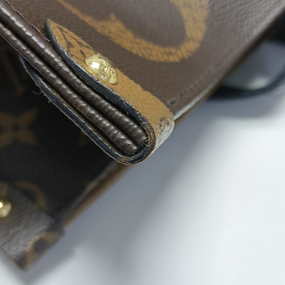 ONTHEGO GM Monogram Coated Canvas Brown