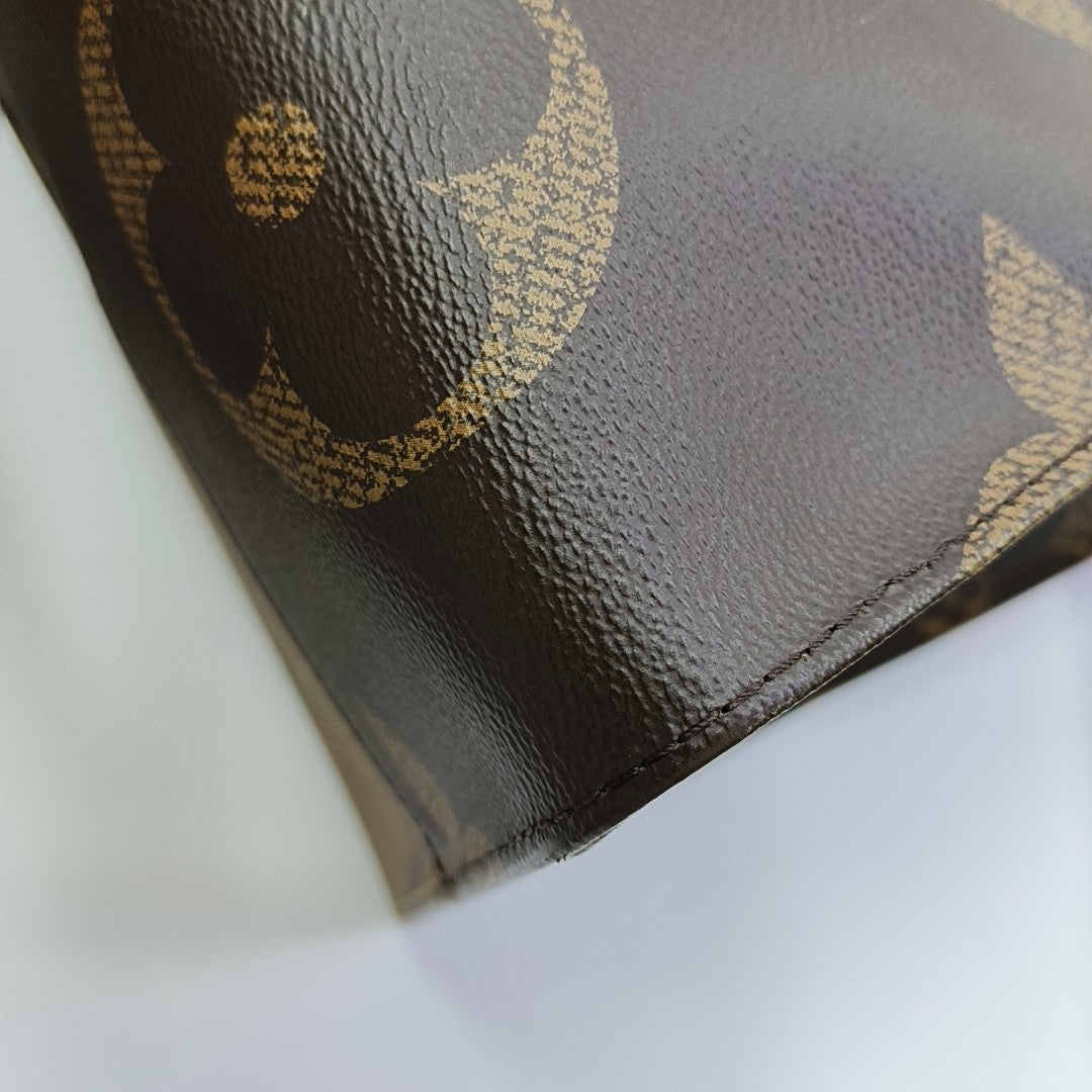 ONTHEGO GM Monogram Coated Canvas Brown