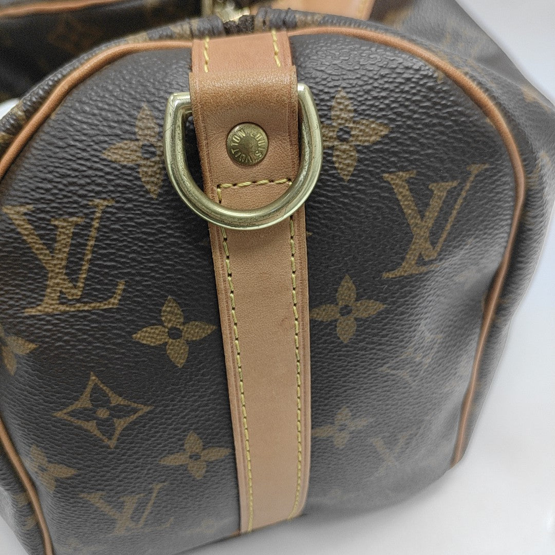 SPEEDY 25 Monogram Coated Canvas Brown