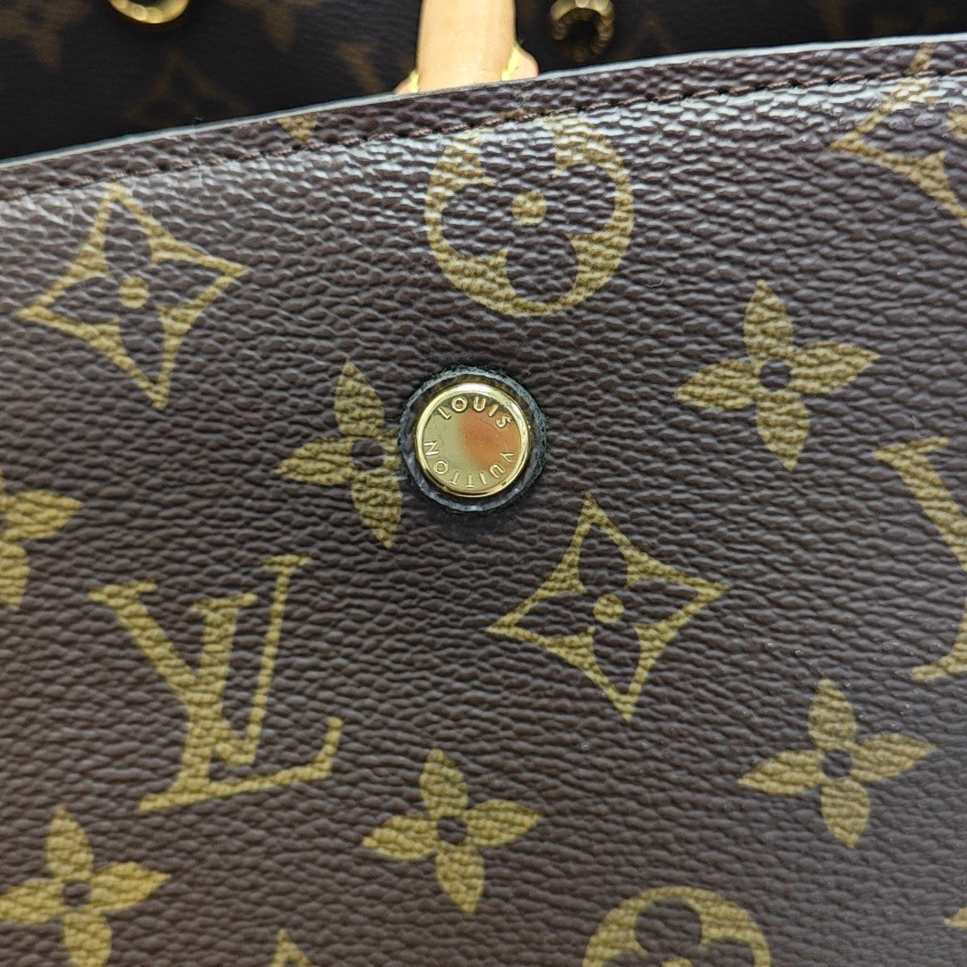 MONTAIGNE GM Monogram Coated Canvas Brown