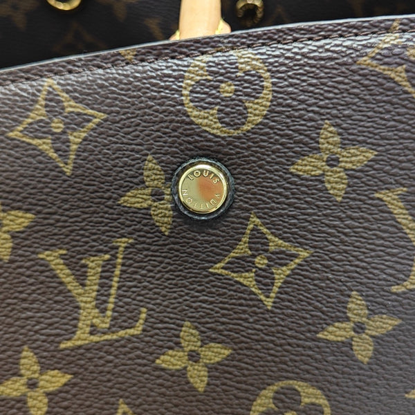 MONTAIGNE GM Monogram Coated Canvas Brown