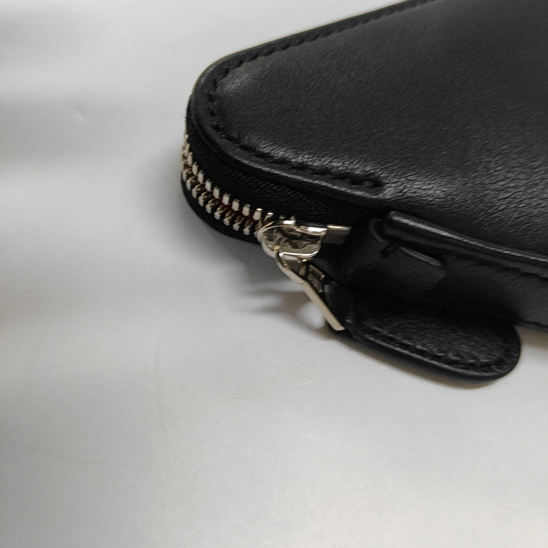 Authenticated pre-owned  Triangle Calfskin Black - Clutch at Looply